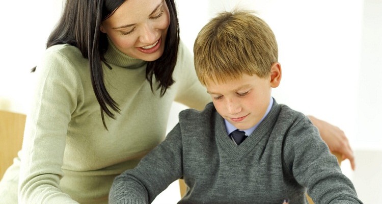 Young Boy Being Tutored by His Teacher