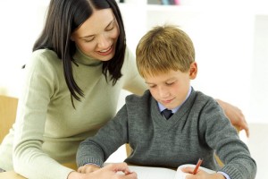 Young Boy Being Tutored by His Teacher